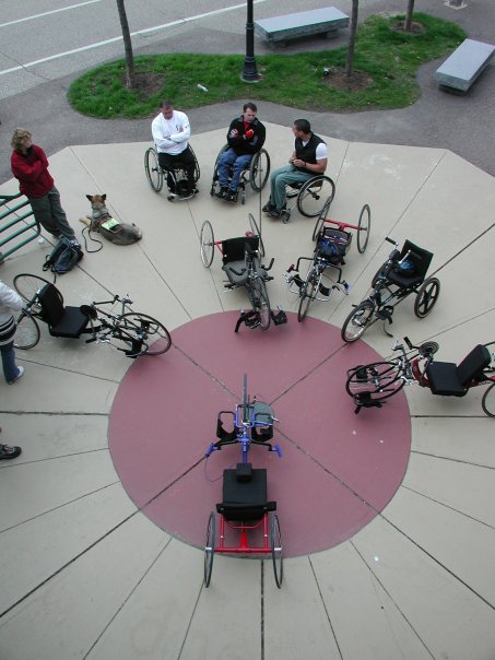 Aerial shot of wheelchair users and handycles in a circle