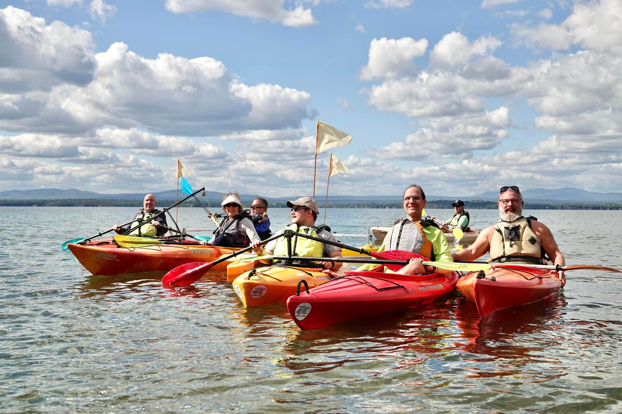 The NDAA Board of Directors in adaptive kayaks on Lake Champlain