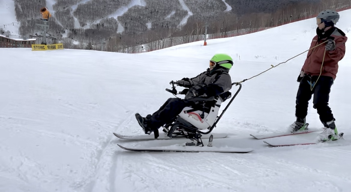 Nate Besio controls the TetraSki with prosthetic arms